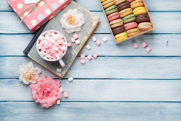 Colorful macaroons in a box and marshmallow