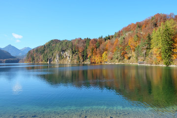 Crystal clear lake with colorful trees