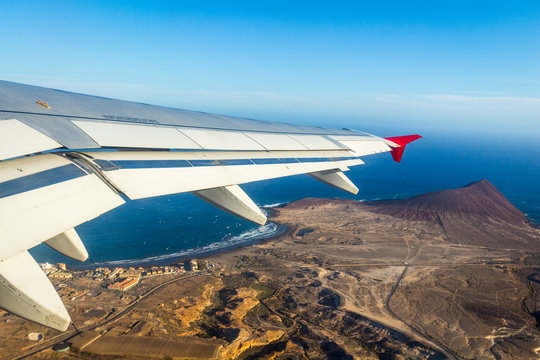island view through aircraft windows over the sea