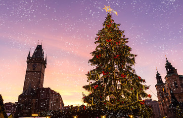 Christmas market with snowfall in Oldtown square (czech: Staromestske namesti) Prague, Czech Republic