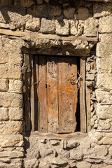 wooden door in a stone wall