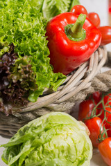Variety of green and red fresh lettuce salad leaves, red paprika