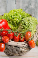 Green fresh roma lettuce salad leaves and roma mini tomatoes - healthy low calorie food