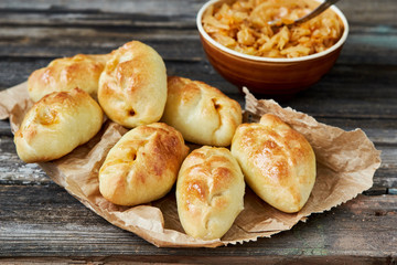 Russian pirozhki (baked patties) stuffed with cabbage.horizontal