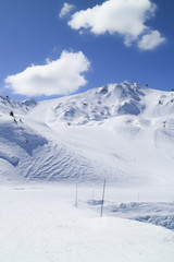 Fototapeta na wymiar La Plagne ski and snowboard slopes in high mountains, Alps, Paradiski, France, in portrait .