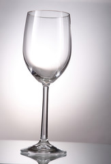 Clear wine glass on a gradient background