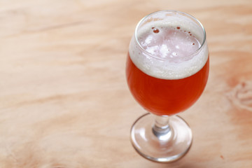 Glass of beer on wood