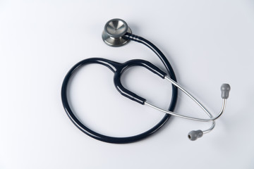 Stethoscope close up view. Stethoscope with reflection. Stethoscope background. Stethoscope with reflection on glossy background. - 129478440