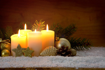 Obraz na płótnie Canvas Four burning advent candles and Christmas decoration.