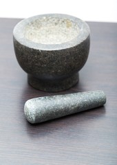 Granite mortar standing on kitchen table