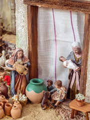 Obraz na płótnie Canvas Nativity scene with hand-colored wooden figures