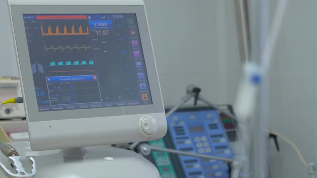 Screen displays patient's condition in ICU, intensive care unit: pulse, blood pressure, temperature, and other parameters