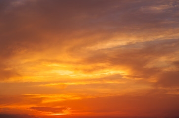 Naklejka na ściany i meble Fiery orange colorful sunset sky. Beautiful sky.