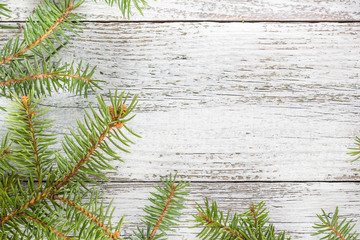 Christmas wooden background with fir tree. Top view copy space