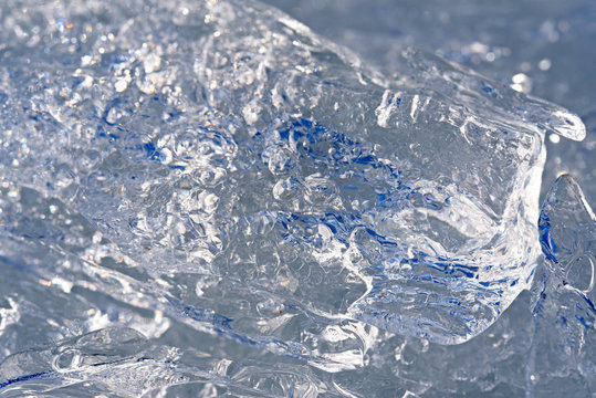 Picture of spring concealing ice floe close up with cracks and b
