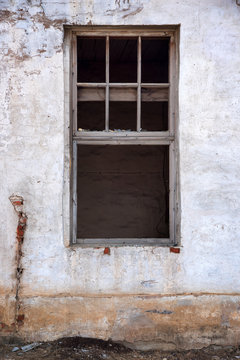 old window on old dirty wall