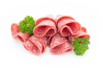 Salami sausage slices isolated on white background.