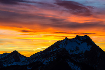 Vibrant sunset behind mountian