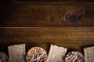 crispbread on wooden background. Space for text