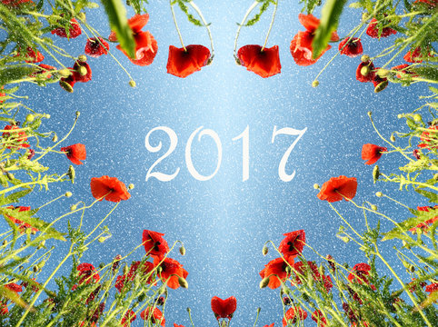 Christmas card with a heart of poppies and snow and the inscript