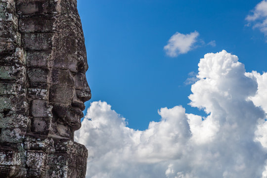 Temple face staring into the clouds
