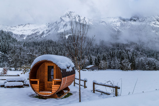 Wooden sauna in a snowy landscape 