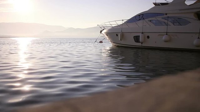 Luxury Yacht at Harbor Before Sunset
