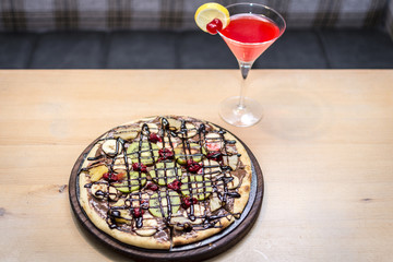 Pizza whit fruit and chocolate and cocktail © nedomacki