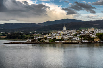 Obraz premium Spanish historic town of Castropol as seen from Ribadeo across the river