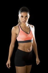 Fototapeta na wymiar latin sport woman posing in fierce and badass face expression with fit slim body