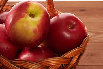 red apples on a wooden table