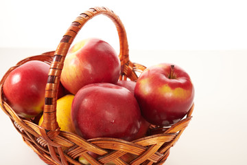 red apples in a basket isolate