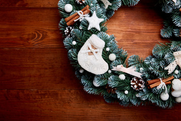 Obraz na płótnie Canvas Christmas wreath on wooden background - Top view. Christmas decoration.