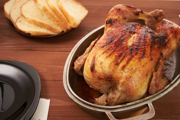 roasted bird on a wooden table
