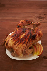 roasted bird on a wooden table