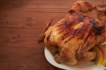 roasted bird on a wooden table