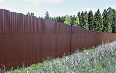 Fence made of brown metal professional flooring