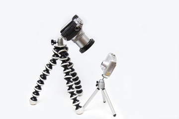 Small and large cameras on tripods