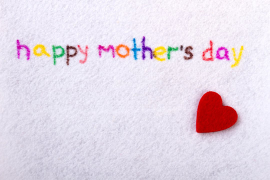 Happy Mother`s Day handwriting. Fabric heart and inscription. Share love with mother. Patterns of ideas for holidays.