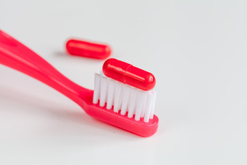 concept toothache with toothbrush and tablet at white background