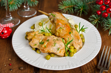 Oven Baked rabbit legs with potatoes and rosemary