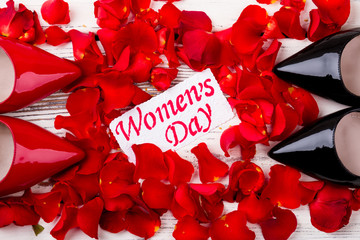 Women`s Day card and petals. Shoes, rose petals, greeting paper. Stylish and romantic present.