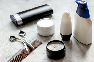 mens cosmetics for hair in bottle at bathroom