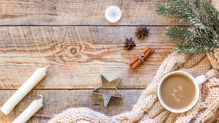 Christmas evening with cup of cocoa wooden background top view