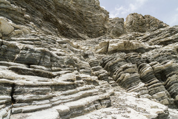 Layered rock formation folds on the Mediterranean island Crete, Greece