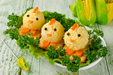 Funny chickens from eggs on the Easter table