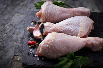 Raw chicken legs with parsley