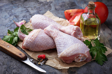 Raw chicken legs with parsley