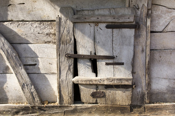Old wooden door in shed in the countryside of Hungary