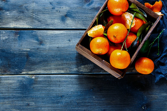 Box of juicy tangerines